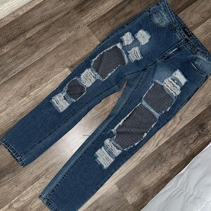 Fashion Nova ripped fish net jeans.